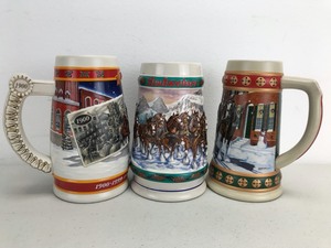 lot 6 image: Vintage Budweiser Holiday Beer Steins (Lot of 3)