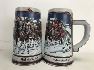 lot 9 image: Pair of 1989 Vintage Budweiser Collector Series Christmas Beer Steins (Lot of 2)