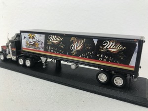 lot 18 image: Miller Genuine Draft Collectable Miniature Semi-Truck w Stand