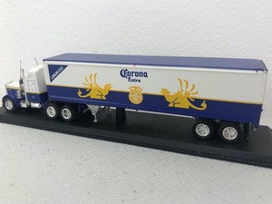 lot 23 image: Corona Beer Beer Collectable Miniature Semi-Truck w Stand