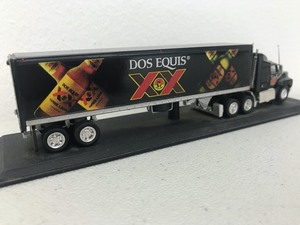 lot 24 image: Dos Equis Beer Collectable Miniature Semi-Truck w Stand