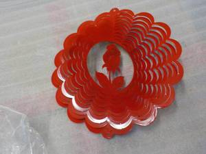 lot 117 image: Red Metal flower spinner...