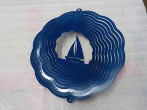 lot 118 image: Blue Metal sailboat spinner...