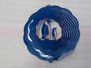 lot 121 image: Blue Metal penguin spinner...