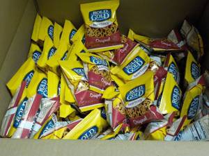 lot 243 image: case of 104 bags gold Rold heartzel...