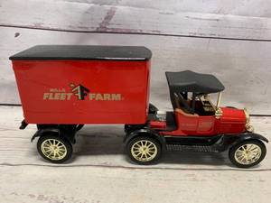 lot 48 image: Vintage Ertl Fleet Farm Model T and Trailer