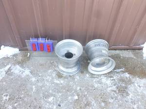 lot 5 image: Qty of 2 atv aluminum wheels. 8 x 8 -4100. Used condition. As shown.