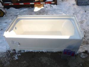 lot 18 image: Acrylic bath tub. 60 x 29. Left drain. Has some chips & cracks that look repairable. As shown.