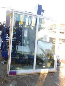 lot 20 image: Reliabilt sliding patio door. 70 12 x 79 12 rough opening. White vinyl. Appears unused.  As shown.