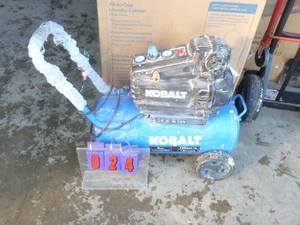 lot 24 image: Kobalt 8 gal air compressor. Runs but only pumps to 30 lbs. As shown.