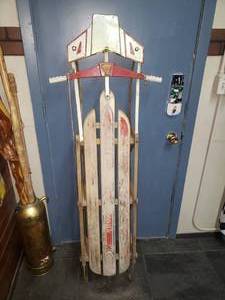 lot 24 image: 1960s Silver Streak Wood Snow Sled wMetal Runners