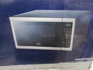 lot 252 image: Oster 1.1 cu ft Microwave open box...