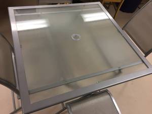 lot 160 image: Glass Top Patio Table w Four Chairs