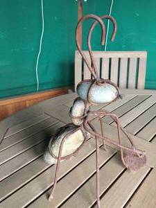 lot 409 image: Fun Grasshopper Metal And Stone Garden Art