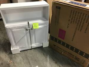 lot 44 image: 23-18 in. W x 27-78 in. H Framed Surface-Mount Bathroom Medicine Cabinet in White by Glacier Bay &nbspin good condition 