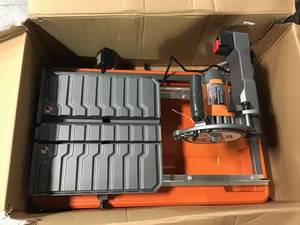 lot 55 image: 9 Amp Corded 7 in. Wet Tile Saw with Stand by RIDGID &nbspin good condition 