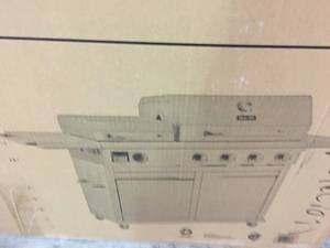 lot 111 image: 4-Burner Propane Gas Grill in Stainless Steel with Griddle in good condition