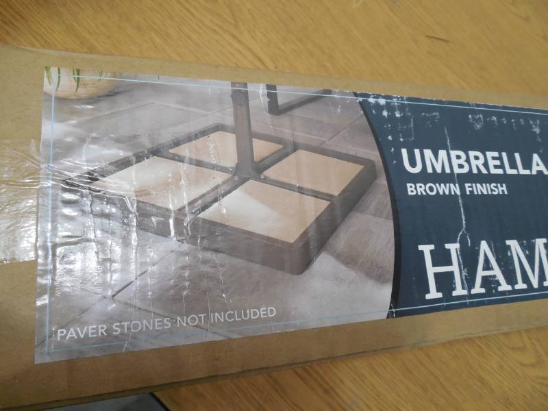 lot 56 image: Steel Outdoor Patio Umbrella Base in Brown