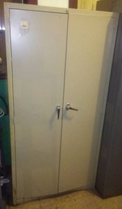 Metal Cabinet with 2 doors. 4 adjustable shelves.