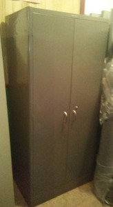 Metal Cabinet with 2 doors. 2 adjustable shelves.