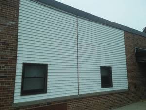 White Steel Siding, Brown Fascia and Downspout