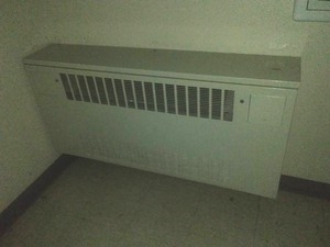 Radiator hallway with controls. Boiler plus electric blower.