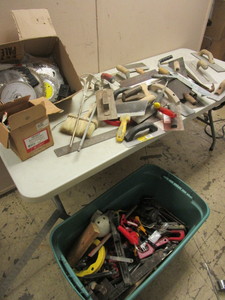 lot 212 image: ASSRTD. DRYWALL TROWELS,  SCRAPERS, SAW BLADES, FRAMING SQUARES, MORE