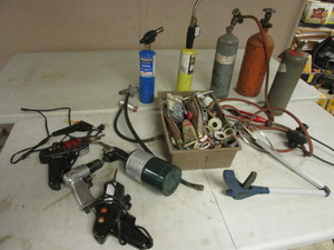 lot 219 image: ASSORTED  TORCH SUPPLES, BERNZ-O-MATIC TRIGGERS, PROPANE TANKS, ELECTRIC GLUE GUNS, MORE