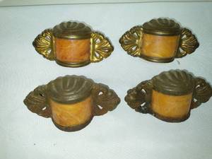 Brass & translucent handles or lamp covers.