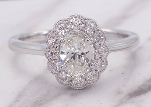 lot 13 image: Exquisite .72 Carat Oval Diamond Halo Ring in 14k White Gold $4450 Retail