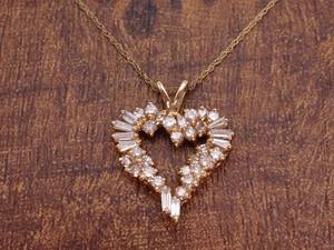 lot 46 image: Gorgeous Diamond Heart Pendant with Round and Baguette Diamonds in 14k Yellow Gold