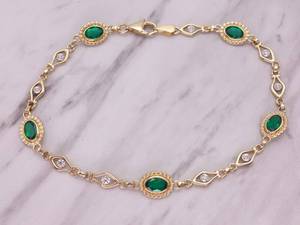 lot 63 image: Ladies Green Stone and Diamond Link Estate Bracelet in Yellow Gold