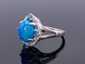 lot 78 image: Opal, London Blue Topaz, and White Zircon Claw Prong Estate Ring