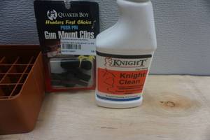 lot 31 image: Hard Shell Case, Quaker Boy Push Pin Gun Mount Clips and Knight Gun Oil