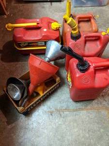 lot 244 image: (4) Gas Cans and Assorted Funnels