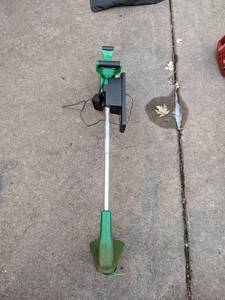 lot 233 image: HandyStik 12 Volt Cordless Weed Eater