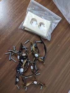 lot 169 image: Simple Outlet Covers and Cupboard Hardware
