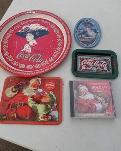 lot 379 image: (4) Coca-Cola Metal Trays & (2) Christmas CDs