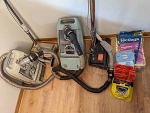 lot 45 image: (4) Vintage Vacuums and Extra Bags