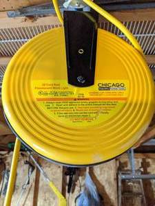 lot 178 image: 30 Cord Reel w Four Way Electrical Adapter