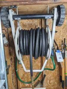 lot 190 image: Garden hose and hose reel