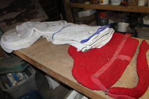 lot 19 image: Lot of (11) Horse Tack and Gear - Fleece Saddle Pads (x4), Saddle Pad with Belly Belt (x1), Small Blankets (x6)