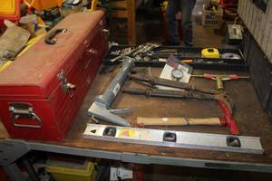 lot 136 image: Craftsman Metal Tool Box, Level, Caulk Gun, Hammers, Gauge, Tape Measure, Sockets, Channel Lock Pliers, U-Joint Set, and more