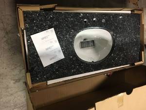 49 in. W Granite Vanity Top in Blue Pearl with White Bowl by Pegasus not used