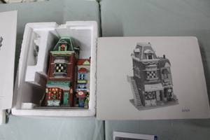 lot 74 image: Department 56 Dorothys Dress Shop Limited Edition 12,500 Pieces from The Heritage Village Collection Christmas In The City Series #5974-9