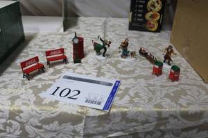 lot 102 image: Lot of (10) Christmas Figurines - Mailboxes (x2), Santa and Sleigh, Man with Umbrella, Woman with Dog, Coca-Cola Benches (x2), Clock, Telephone Booth, Dancers