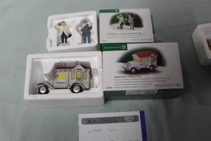 lot 100 image: Lot of (2) Department 56 Russell Stover Delivery Truck from The Heritage Village Collection Christmas In The City Series #56.58972, City Professionals - Postman & Delivery Man from The Heritage Village Collection Christmas In The City Series ##56.58965