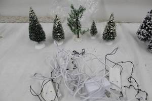 lot 110 image: Lot of (6) Christmas Tree Figurines with Lighting Wiring Harness, Power Cords, Adapters