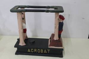lot 9 image: Acrobat Cast Iron Coin Bank