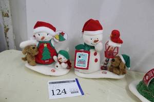 lot 124 image: Lot of (2) Hallmark Celebrating 10 Years Merry Carolers Trio Snowman Lighted Singing Dcor, 2015 Snowman with Cookies Singing Dcor